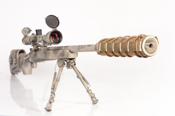 Sniper rifle with a desert camouflage pattern, shot in studio on a white background.