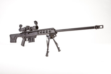 Sniper rifle facing to the right  on a bipod, shot in studio.