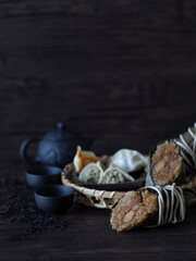 Zongzi or Bak Zhang Dark Food Photography. Traditional Chinese glutinous rice stuffed with pork. Dragon Boat Festival Bak Chang.