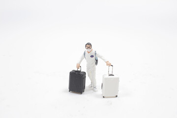 a mini Passenger figure Pulling Rolling Bag