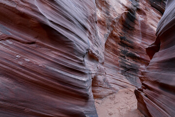 Slot Canyons, commonly found in arid areas such as Utah, Arizona and southwest USA are formed by water erosion typically in sandstone and are at risk of flash flooding