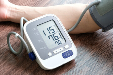 Man check blood pressure monitor and heart rate monitor with digital pressure gauge. Health care...