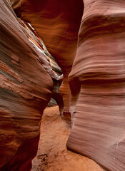 Slot Canyons, commonly found in arid areas such as Utah, Arizona and southwest USA are formed by water erosion typically in sandstone and are at risk of flash flooding