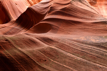 Slot Canyons, commonly found in arid areas such as Utah, Arizona and southwest USA are formed by water erosion typically in sandstone and are at risk of flash flooding