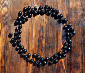 
black currant laid out in a circle lies on the table