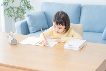 Naklejka premium 勉強 アジア人 子供 ポートレート
