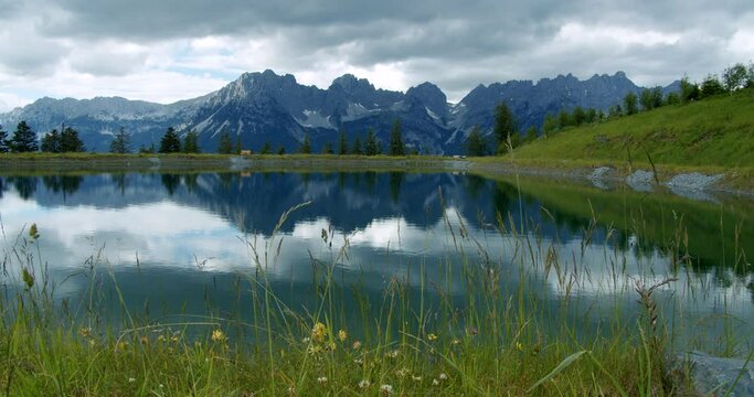 Austria, Astberg lake in Ellmau with mirrored wilderkaiser mountains on water surface