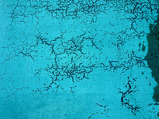 abstract texture turquoise background with cracks and craquelure