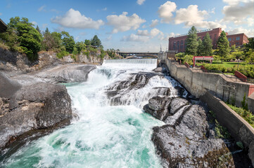 The Spokane Falls Dam next to the old Water and Power building in Riverfront Park, downtown...