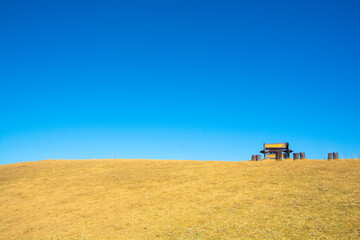 Naklejka premium Ladscape landmark label and dry grass hilltop at Doi Samer Dao in Nan , Thailand (Public Domain)