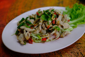 Pork with Lemon spicy-sweet sauce with chili and garlic mixed with sour lemon juice.