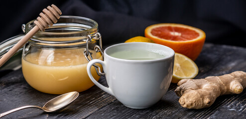 Hot vitamin tea with ginger, lemon and honey. Concept of healthy tea for cold days or a flu