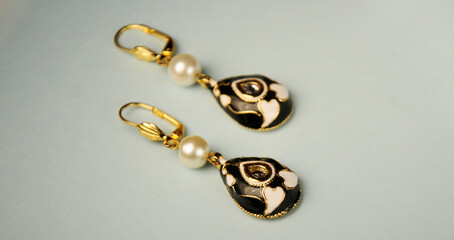 Close-up of a pair of red  Pearl earrings