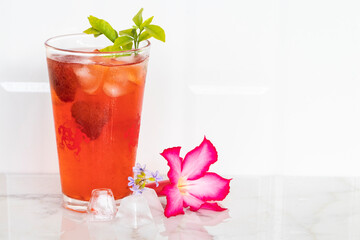 herbal healthy drinks cold strawberry juice with pink flower and iced of lifestyle in summer...