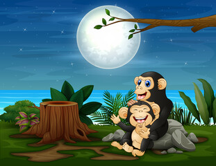 The chimpanzee having fun at night landscape