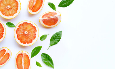 High vitamin C. Juicy grapefruit with leave on white background.