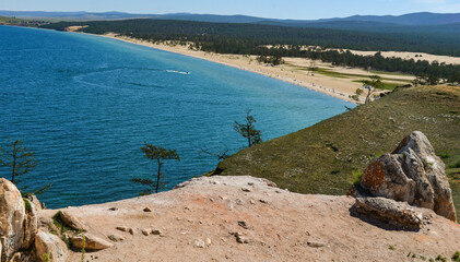 View of the coast of Lake Baikal, Olkhon Island in summer in sunny weather from a cliff