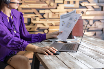 Business woman in formal dress using computer notebook for teleconference with her colleagues during quarantine for COVID-19 or Coronavirus as a business in new normal. Woman uses technology