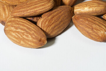 Almonds near the white background have space to place text.