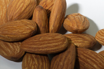 Close-up, almonds, placed together, white background.