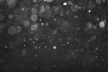 gray bokeh White and Silver lights on bokeh abstract background.