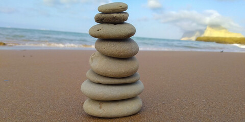 Fototapeta na wymiar stack of stones on the beach