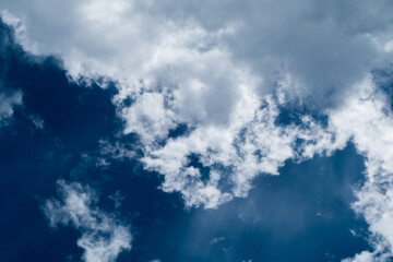 floating white cloud in bright blue sky in sunny day
