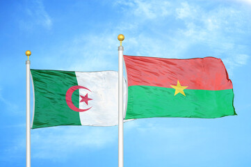 Algeria and Burkina Faso two flags on flagpoles and blue sky