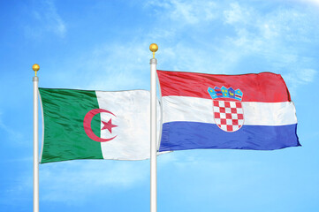 Algeria and Croatia two flags on flagpoles and blue sky