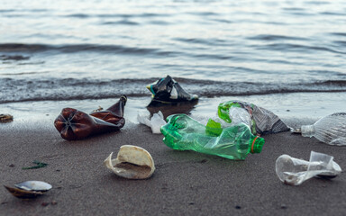 Plastic garbage lying on the beach