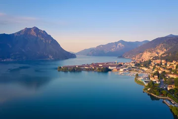 Fotobehang Aerial view of Lake Iseo at sunrise, on the right the port of lovere,background mountains(alps), Bergamo Italy. © robertobinetti70