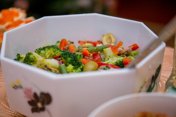 salads in dishes on the kitchen table
