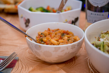 salads in dishes on the kitchen table