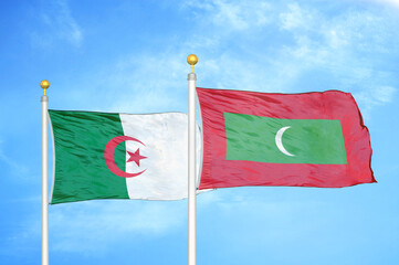 Algeria and Maldives two flags on flagpoles and blue sky
