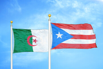 Algeria and Puerto Rico two flags on flagpoles and blue sky