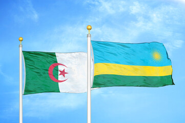 Algeria and Rwanda two flags on flagpoles and blue sky