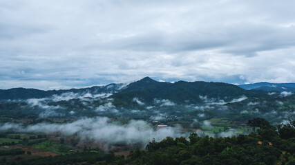 Fototapeta na wymiar Landscape image of foggy greenery rainforest mountains and hills