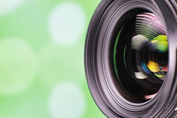 Equipment videographer and photographer. Lenses on the table against the background of bright...
