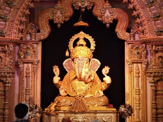 Ganesha,Dagdusheth ganpati,pune,Ganesh festival,ganesh chaturthi,indian festival,ganesh chaturthi,lord ganesha,ganesh,indian culture,ganpati pandal,prayer,man praying,golden ganesha,temple,statue