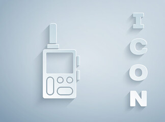 Paper cut Walkie talkie icon isolated on grey background. Portable radio transmitter icon. Radio transceiver sign. Paper art style. Vector.