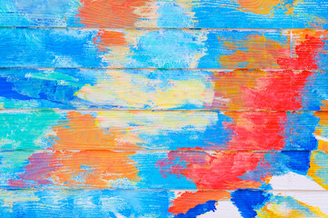 Abstract colorful paint on textured wooden wall,paint background