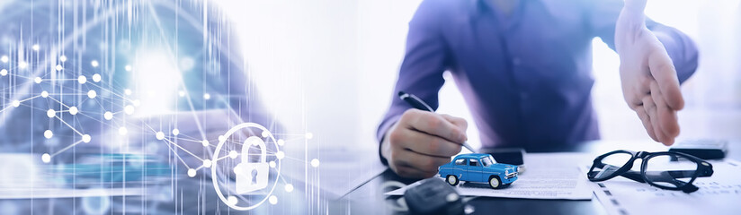 The insurance agent signs a document. Car insurance policy. Auto insurance policy. Forms for...