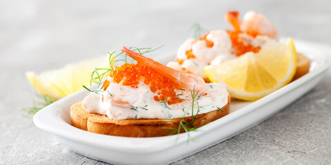 Toast skagen - shrimp and caviar on toast. Classic swedish appetizer. Selective focus. Copy space