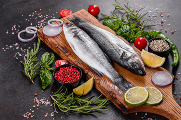 Fresh fish seabass and ingredients for cooking. Raw fish seabass