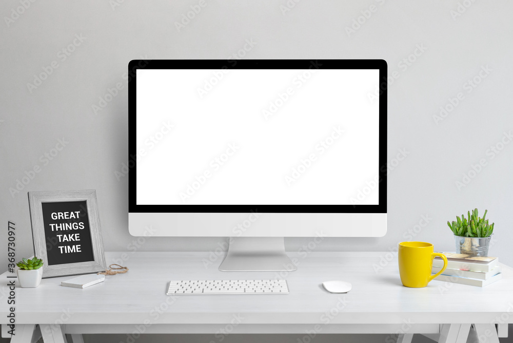 Poster computer display mockup. web design presentation template. modern studio work desk with plant, pictu