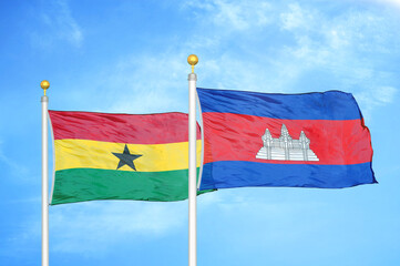 Ghana and Cambodia two flags on flagpoles and blue sky