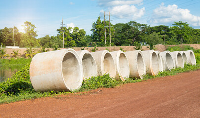 Cement pipes beside the countryside road.