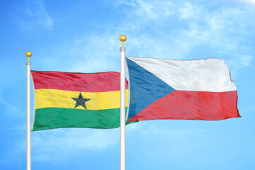 Ghana and Czech Republic two flags on flagpoles and blue sky