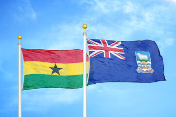 Ghana and Falkland Islands two flags on flagpoles and blue sky