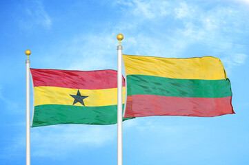 Ghana and Lithuania two flags on flagpoles and blue sky